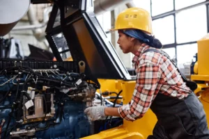 young female technician in coveralls and hardhat c 2023 11 27 05 26 57 utc